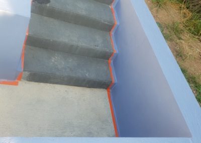 Réalisation d'un mur avec escalier et finition peinture